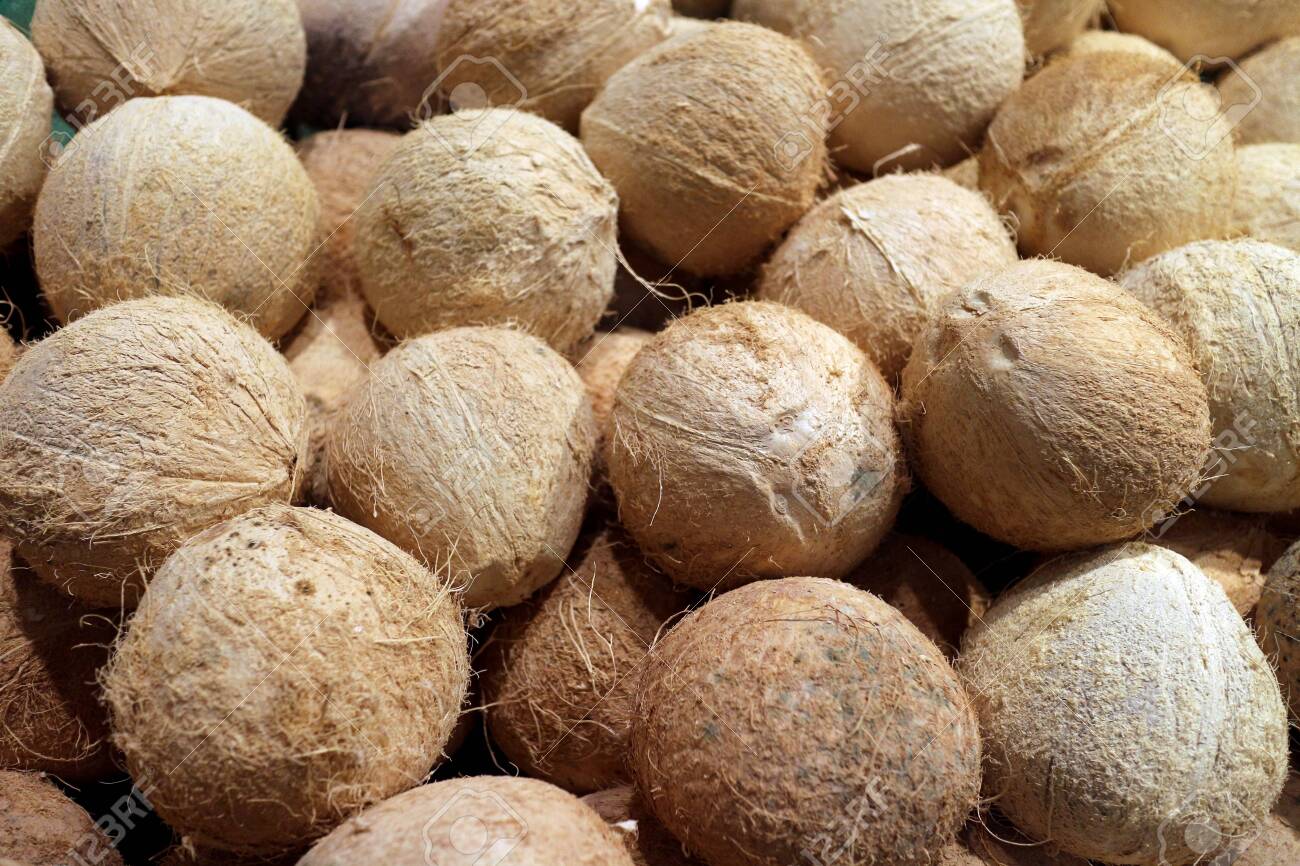 A heap of peeled coconut at market place